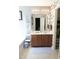 Main bathroom with double vanity, a large mirror, and tiled floors at 509 Hallie Long Ln, Burlington, NC 27217