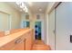 Bright hallway with built-in storage and laundry closet at 103 W Main St # 405, Durham, NC 27701