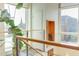Upper landing with city views and modern railing at 103 W Main St # 405, Durham, NC 27701