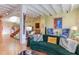 Living room with green sofa and unique artwork at 103 W Main St # 405, Durham, NC 27701