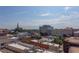 Cityscape view with various buildings and a church steeple in distance at 103 W Main St # 405, Durham, NC 27701
