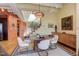 Stylish dining area with a round table and mid-century modern decor at 103 W Main St # 405, Durham, NC 27701