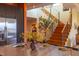 Kitchen features an island with seating and a view of the staircase at 103 W Main St # 405, Durham, NC 27701