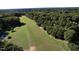 Property's aerial view showcasing large lot and trees at 1612 Us 64, Apex, NC 27523