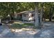 Single story home exterior surrounded by trees at 1612 Us 64, Apex, NC 27523