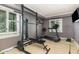 Home gym with a squat rack, treadmill and other equipment at 9500 Ligon Mill Rd, Wake Forest, NC 27587