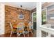 Charming breakfast nook with a brick accent wall and access to a deck at 9500 Ligon Mill Rd, Wake Forest, NC 27587