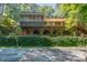 Back of house with large deck and ivy covered wall at 9500 Ligon Mill Rd, Wake Forest, NC 27587