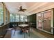 Relaxing screened porch with wicker furniture and ceiling fan at 9500 Ligon Mill Rd, Wake Forest, NC 27587