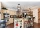 Eat-in kitchen with an island, custom cabinetry, and a tiled backsplash at 9500 Ligon Mill Rd, Wake Forest, NC 27587