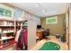 Home office with built-in shelving, desk, and ample natural light at 9500 Ligon Mill Rd, Wake Forest, NC 27587