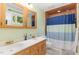 Bathroom with double vanity, updated fixtures, and a shower/tub combo at 9500 Ligon Mill Rd, Wake Forest, NC 27587