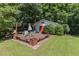 Brick patio with seating area, umbrella and shed at 9500 Ligon Mill Rd, Wake Forest, NC 27587