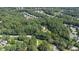 Aerial view of a wooded lot near neighborhood, ideal for new home at 9500 Ligon Mill Rd, Wake Forest, NC 27587