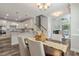 Open dining area with kitchen views, and a modern chandelier at 622 Chronicle Dr, Cary, NC 27513