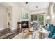 Spacious living room with fireplace, large windows, and access to a balcony at 622 Chronicle Dr, Cary, NC 27513