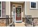 Attractive brown front door with sidelights and a wreath, welcoming guests into the home at 622 Chronicle Dr, Cary, NC 27513