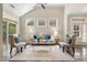 Bright living room with comfy seating, large windows, and hardwood floors at 622 Chronicle Dr, Cary, NC 27513