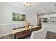 Bright dining area with a view into the kitchen at 622 Chronicle Dr, Cary, NC 27513