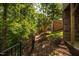 Landscaped backyard with a wooden fence and wooded area at 622 Chronicle Dr, Cary, NC 27513