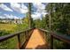 Wooden boardwalk path with a view of community homes at 622 Chronicle Dr, Cary, NC 27513