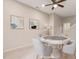 Virtually staged game room with round table and seating at 622 Chronicle Dr, Cary, NC 27513