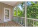 Screened porch with wood decking and wooded views at 622 Chronicle Dr, Cary, NC 27513