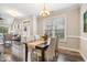 Elegant dining room featuring a wood table, four chairs, and a chandelier at 622 Chronicle Dr, Cary, NC 27513