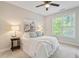 Bright bedroom with ceiling fan and large window at 622 Chronicle Dr, Cary, NC 27513