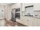 Modern kitchen with stainless steel appliances and white cabinetry at 622 Chronicle Dr, Cary, NC 27513