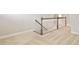 Home hallway with carpeted floors and wooden staircase at 622 Chronicle Dr, Cary, NC 27513