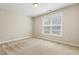 Bright bedroom featuring a large window and carpet at 622 Chronicle Dr, Cary, NC 27513
