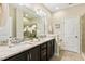 Bathroom with double vanity, granite countertop, and large mirror at 622 Chronicle Dr, Cary, NC 27513