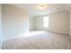 Well-lit bedroom with neutral walls and carpet at 315 Tobacco Barn Dr, Angier, NC 27501