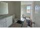 Main bathroom with a bathtub, toilet, vanity, and flooring at 335 Tobacco Barn Dr, Angier, NC 27501