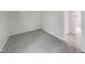 Simple carpeted bedroom with access to another room at 2146 Charles St # 9, Durham, NC 27707