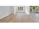 Finished basement with hardwood floors, a window, and access to the outdoors at 2506 Silas Peak Ln, Apex, NC 27523