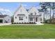 Two story white brick house with landscaping at 2506 Silas Peak Ln, Apex, NC 27523