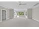 Spacious bedroom with a ceiling fan and large windows offering abundant natural light at 2506 Silas Peak Ln, Apex, NC 27523