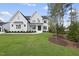 Two story white brick house with landscaping at 2506 Silas Peak Ln, Apex, NC 27523