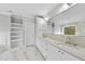 Elegant bathroom with double vanity, marble countertops, and large mirror at 2506 Silas Peak Ln, Apex, NC 27523