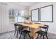 Modern dining area with light wood table and black chairs at 2833 Egert Dr, Haw River, NC 27258