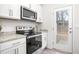 Kitchen stove and back door view at 2833 Egert Dr, Haw River, NC 27258