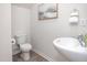Small bathroom with pedestal sink and toilet at 2833 Egert Dr, Haw River, NC 27258
