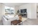 Light-filled living room with neutral decor and hardwood floors at 2833 Egert Dr, Haw River, NC 27258