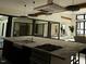 Modern kitchen with large island, stainless steel appliances, and marble countertops at 10397 Holt, Chapel Hill, NC 27517