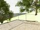 Stone patio with glass railing and treetop views at 10397 Holt, Chapel Hill, NC 27517