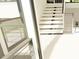 Modern white staircase with metal railings, bright and airy at 10397 Holt, Chapel Hill, NC 27517