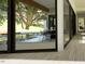 View of a refreshing pool through glass doors, an inviting outdoor space at 10397 Holt, Chapel Hill, NC 27517