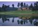 Elegant clubhouse near lake with reflection at dusk at 10397 Holt, Chapel Hill, NC 27517